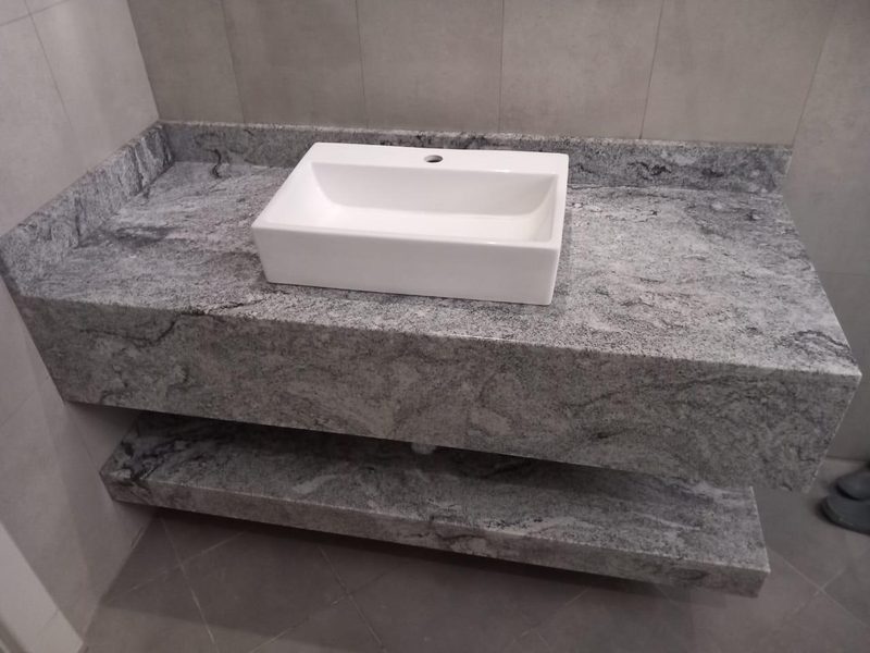 Grey marble washbasin counter with a vessel basin and a stepped plinth — Reef Al Ghadeer, Al Ain